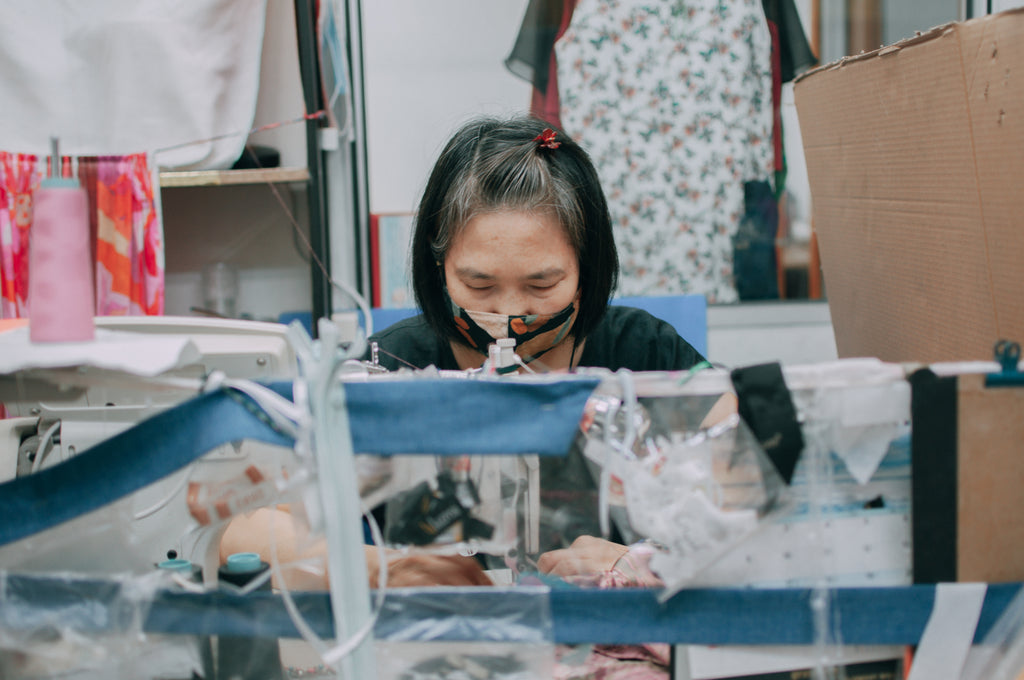 An employee at work in front of the sewing machine