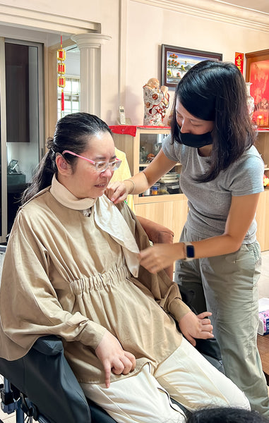 Elisa adjusting the customised scarf on Jane