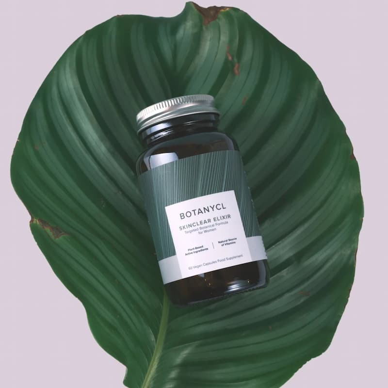 Botanycl SkinClear Elixir on green leaf