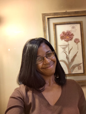 donchellee fulwood young black woman with straight hair and glasses smiling