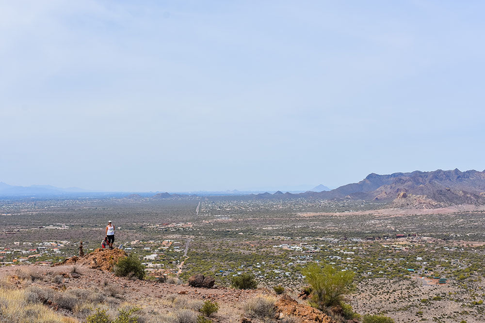 Taking in the view from the top of our hike on the Treasure Loop Trail at the Lost Dutchman State Park, Superstition Mountains, Arizona. Spring Road Trip with Davis Taylor Trading Co.