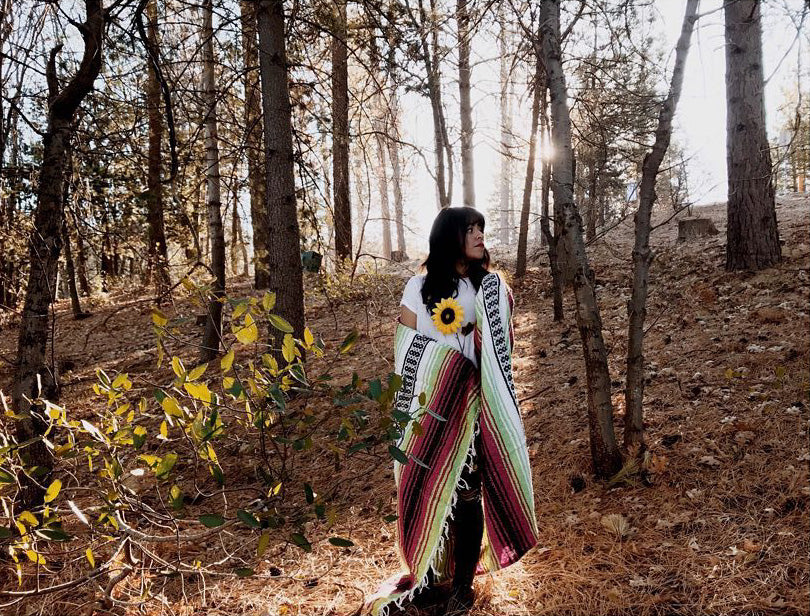 Wrapped up in the warmth of the Neon Candy Bohemian Fiesta Blanket while exploring the mountains in Southern California on a brisk fall day.