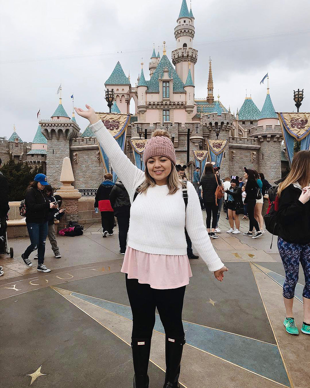 Having a blast at Disneyland on a cold winters day! Rocking the cutest pom beanie to keep my head warm all day long.