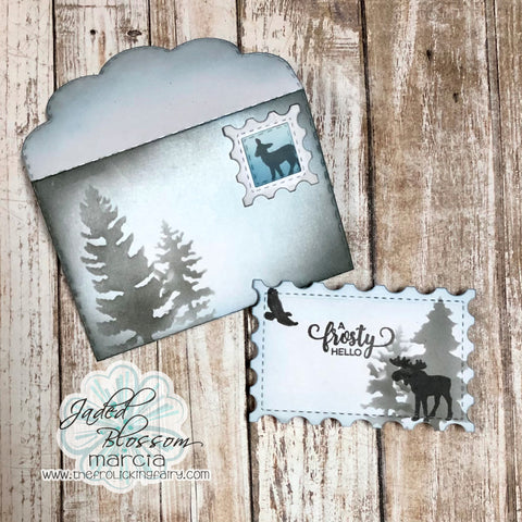 #thefrolickingfairy #jadedblossom #bloghop #treescene #silhouette #woodlandscene #frosty #frostyhello #hellowinter #moose #deer #postage #postagestamp #postagedie #foldinggiftcardholder #giftcardholder #inkblending #stencil #distressoxide #cardmaker #cardmaking #cardmakersofinstagram