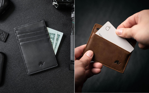 A black leather wallet holding a few dollar bills & pulling out a business card from their brown leather wallet