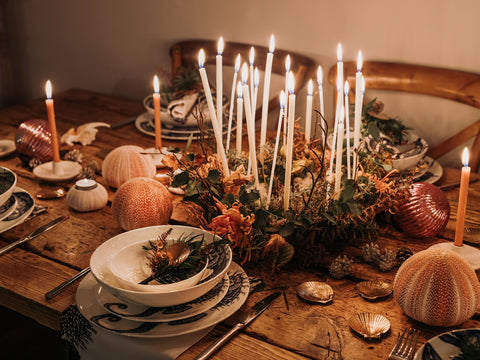 Lifestyle shot of table laid with Cream Cornwall classic china and candle centrepiece