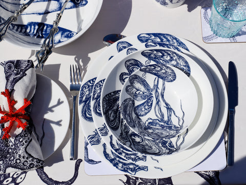 Bone china plates, bowls and pasta bowls with a mussel and oyster design in classic blue and white Cornish colours.