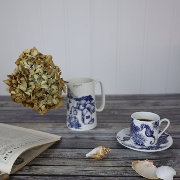 Dried short hydrangea in blue and white jug