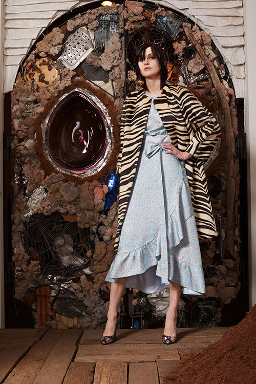 Cynthia Rowley Pre-Fall 2018 Look 11 featuring a light blue floral print cotton ruffle wrap dress with zebra print coat