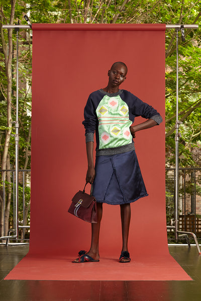 Cynthia Rowley Resort 2017 look 13 featuring a navy printed sweatshirt and navy knee length skirt