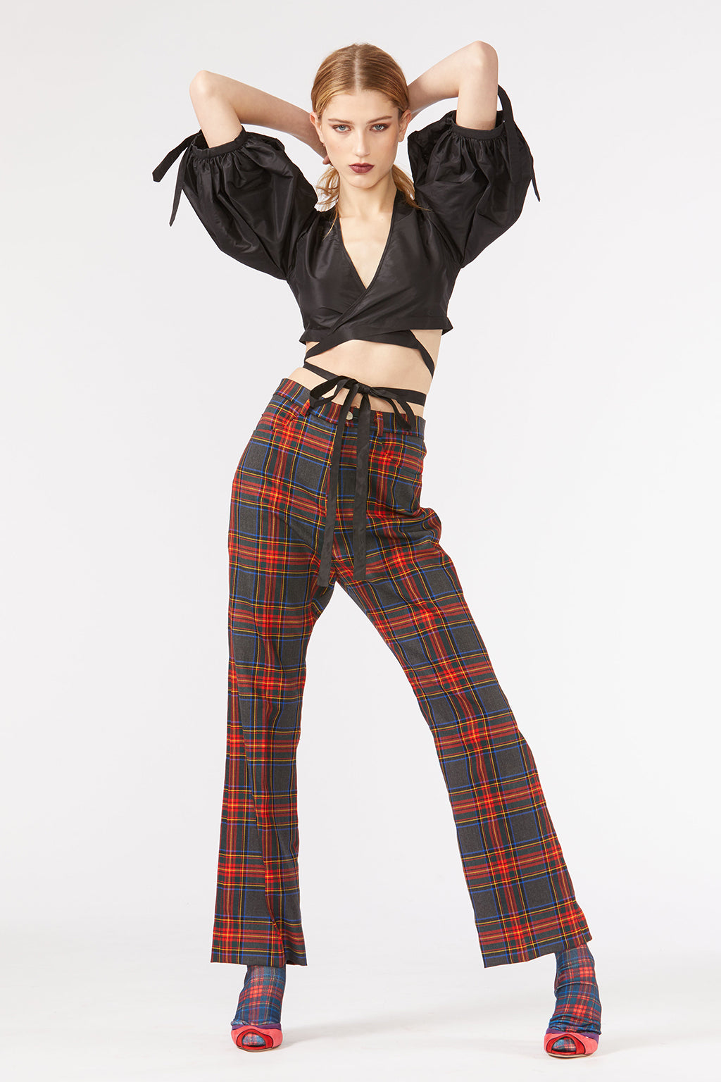 Cynthia Rowley Fall 2018 look 23 featuring plaid pants and cropped black taffeta top with puff sleeves and tie around waist.
