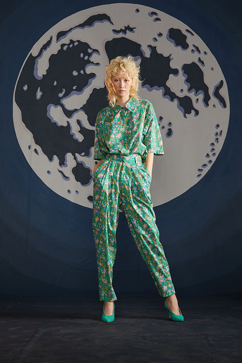 Cynthia Rowley Spring 2019 look 2 featuring a green floral print top and matching pants with belt 