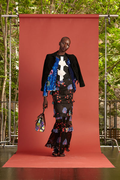 Cynthia Rowley Resort 2017 look 32 featuring a black floral cotton t shirt, black jacket, and black floral tiered maxi skirt