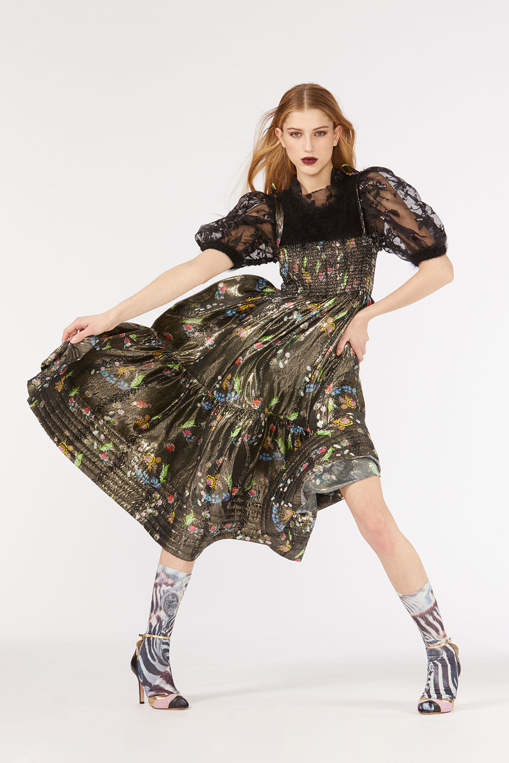 Cynthia Rowley Fall 2018 look 34 featuring a metallic floral tiered dress with smocking across chest and black embroidered tulle puff sleeves. 