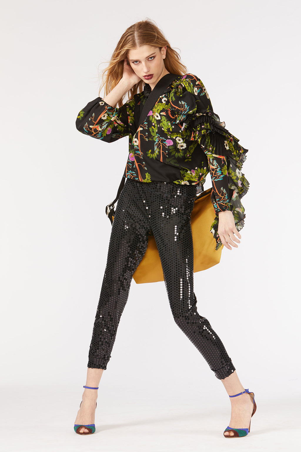 Cynthia Rowley Fall 2018 look 4 featuring sequin leggings and printed blouse with ruffled sleeve.