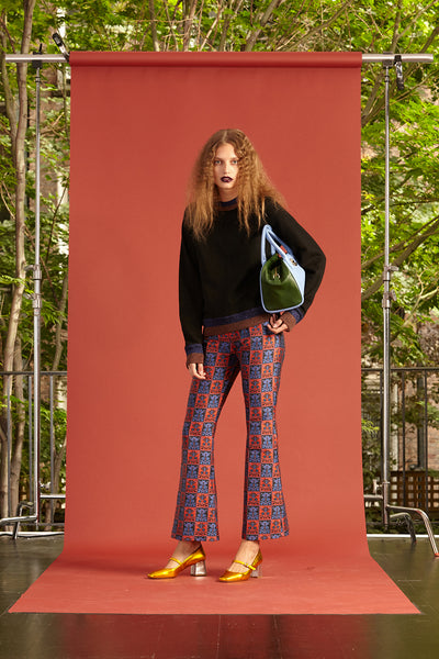 Cynthia Rowley Resort 2017 look 8 featuring a navy sweatshirt and red and blue brocade pants