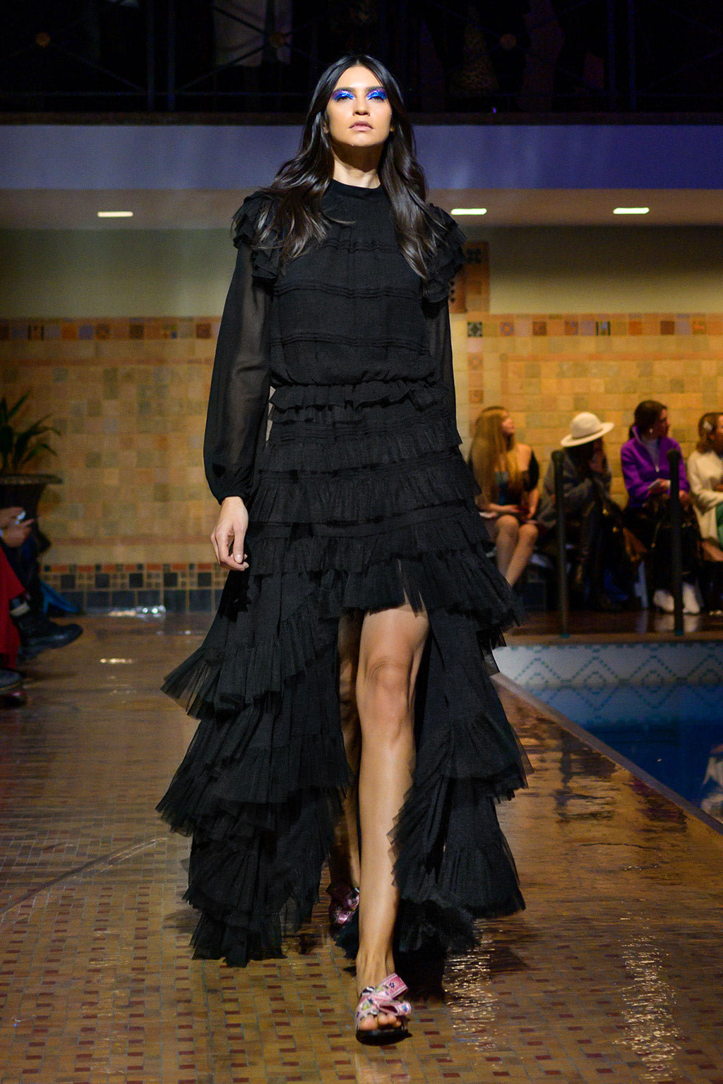 Cynthia Rowley Fall 2019 look 11 featuring a black maxi dress with long sheer sleeves, ruffles and a split at the front