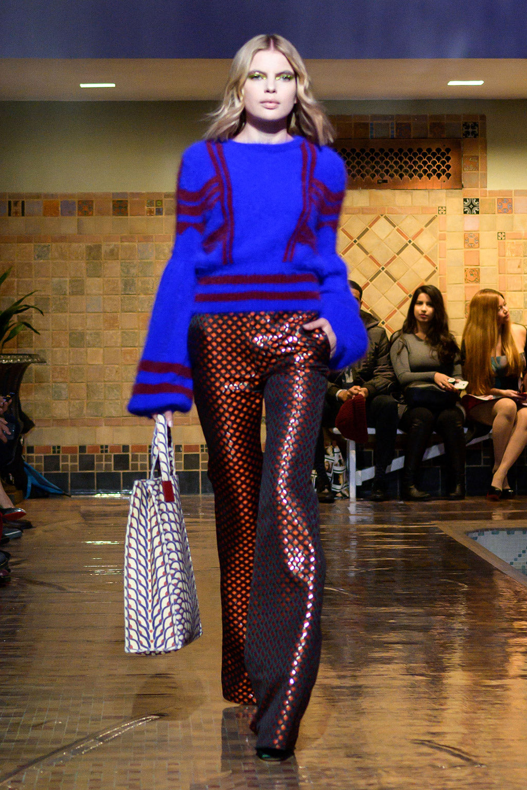 Cynthia Rowley Fall 2019 look 14 featuring a sweater with abstract print and pants with orange and black fish scale print