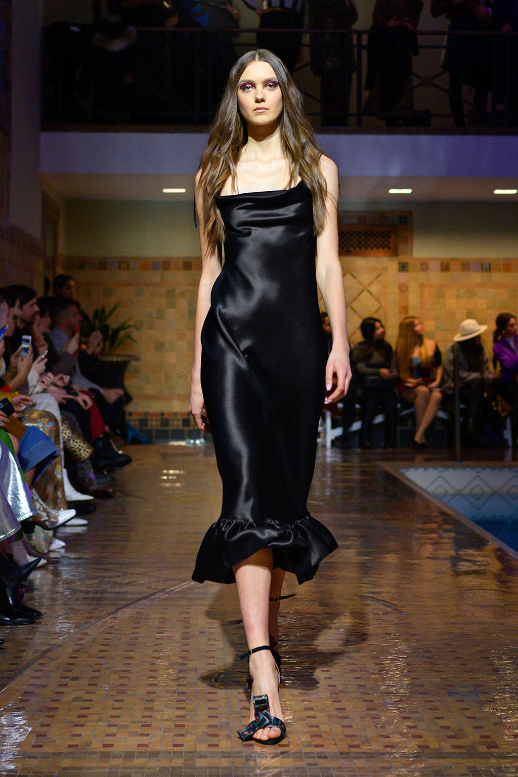 Cynthia Rowley Fall 2019 look 6 featuring a black satin slip dress with ruffle finish at the bottom