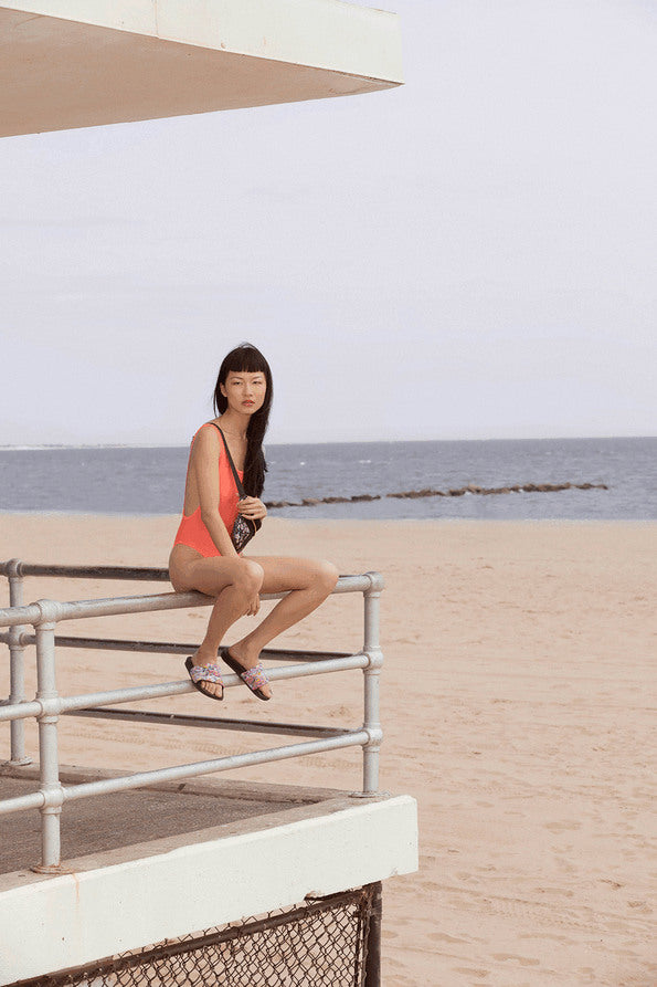 Resort Surf & Swim 2019 Collection look 16 features a red swimsuit with embroidered details and a low back