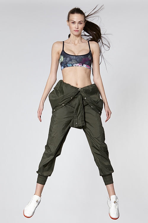 Cynthia Rowley Fall Fitness 2015 look 4 featuring an army green nylon jumpsuit and dark floral print sports bra