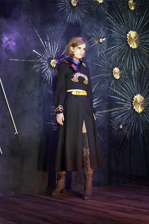 Cynthia Rowley Fall 2014 look 21 featuring a black long sleeve top with a embellished applique across the chest and a black and brown ombre calf length skirt with a slit up the side and a red green and blue silk scarf