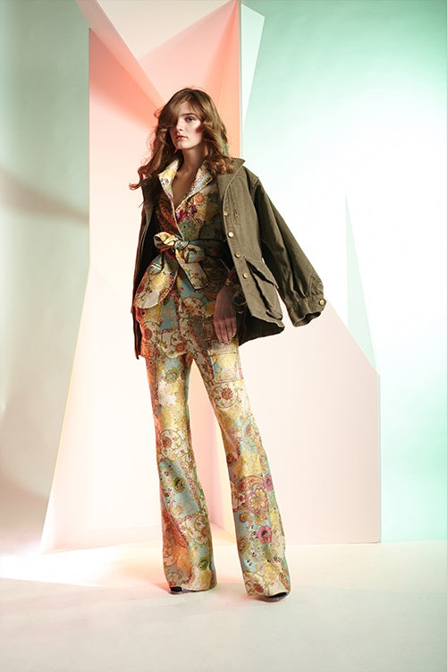 Cynthia Rowley Fall 2016 look 24 featuring chinoiserie floral jacquard cargo flare pants and blazer with waist tie, and army green cotton jacket