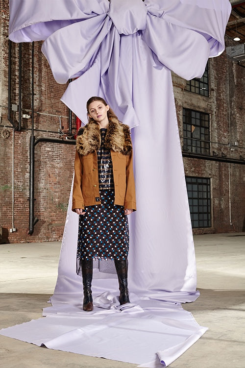 Cynthia Rowley Fall 2017 Look 25 featuring an embroidered tulle midi skirt, sequin striped t-shirt and brown denim jacket with fur collar