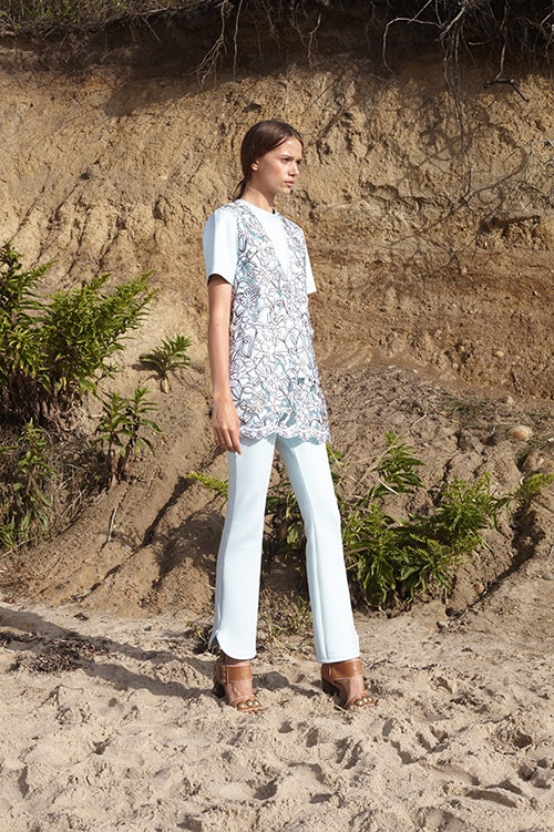 Cynthia Rowley Spring 2016 look 14 featuring light green bonded neoprene flare pants and t-shirt worn below a v-neck brown and light green lace tunic 