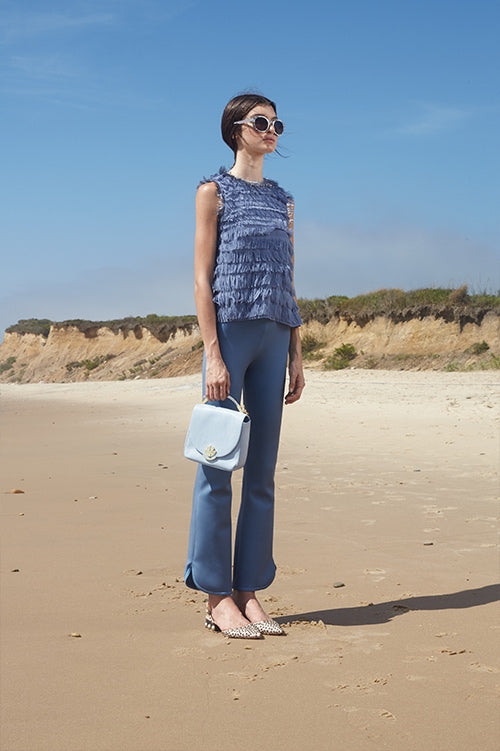 Cynthia Rowley Spring 2016 look 23 featuring blue bonded nylon flare pants and sleeveless blue fringe top