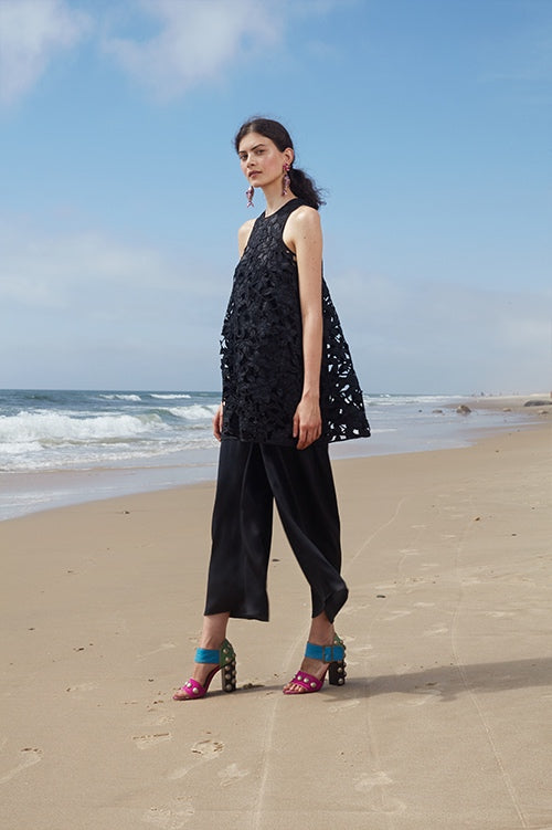 Cynthia Rowley Spring 2016 look 24 featuring black silk wide leg pants worn under a black lace sleeveless a-line mini dress