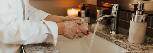 Washing hands with soap bar