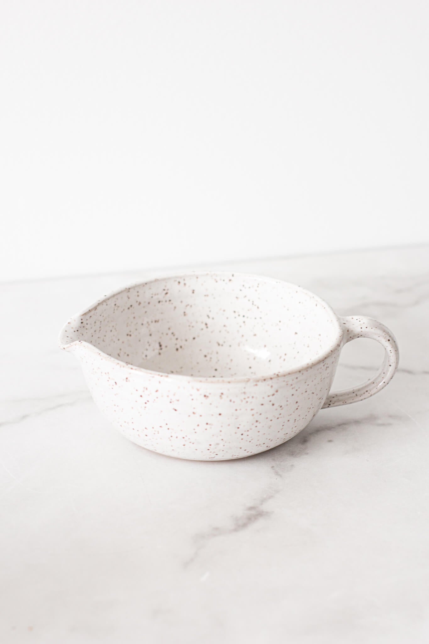 https://cdn.shopify.com/s/files/1/1916/7569/products/RachaelPots_ClaySaladDressingBowl-1_1600x.jpg?v=1636853324