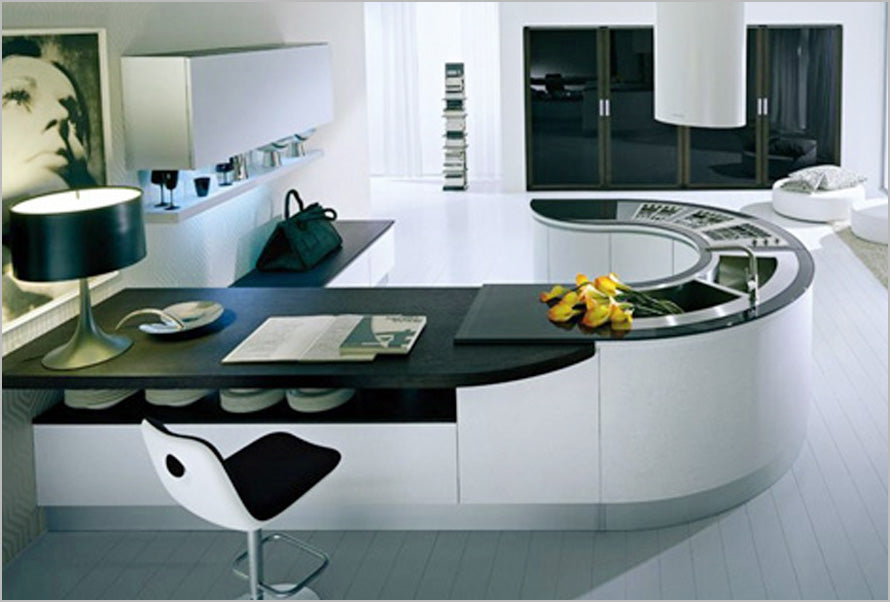 A hook shaped kitchen counter with sink and storage space, plus breakfast bar
