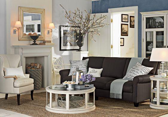 Cream and dark blue living room, with cream arm chair and brown sofa