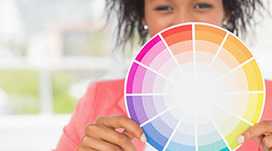 Woman holding up a colour wheel