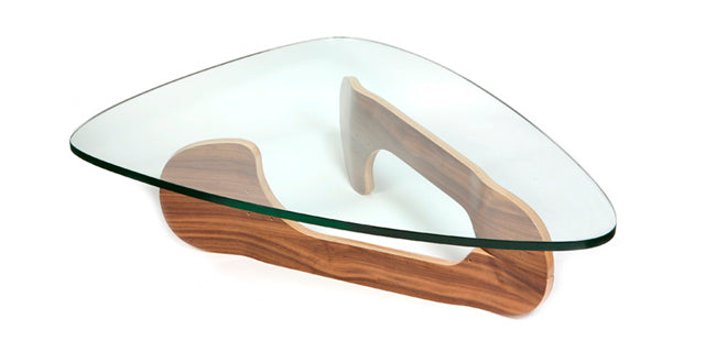 Glass coffee table shaped like a guitar pick