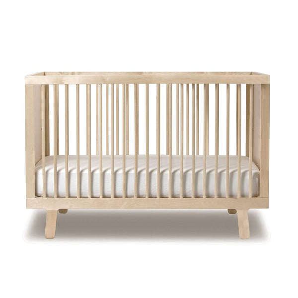 white and natural wood crib