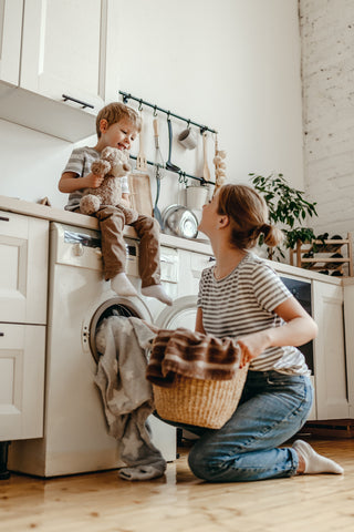 Woman and child doing the washing