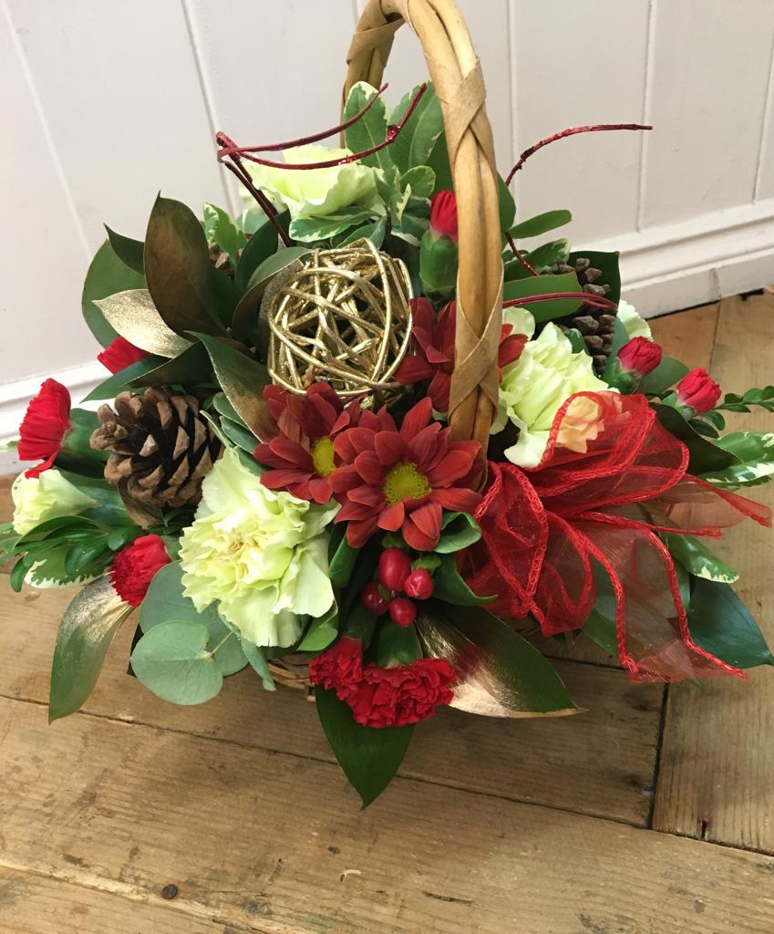 christmas flower arrangements in baskets