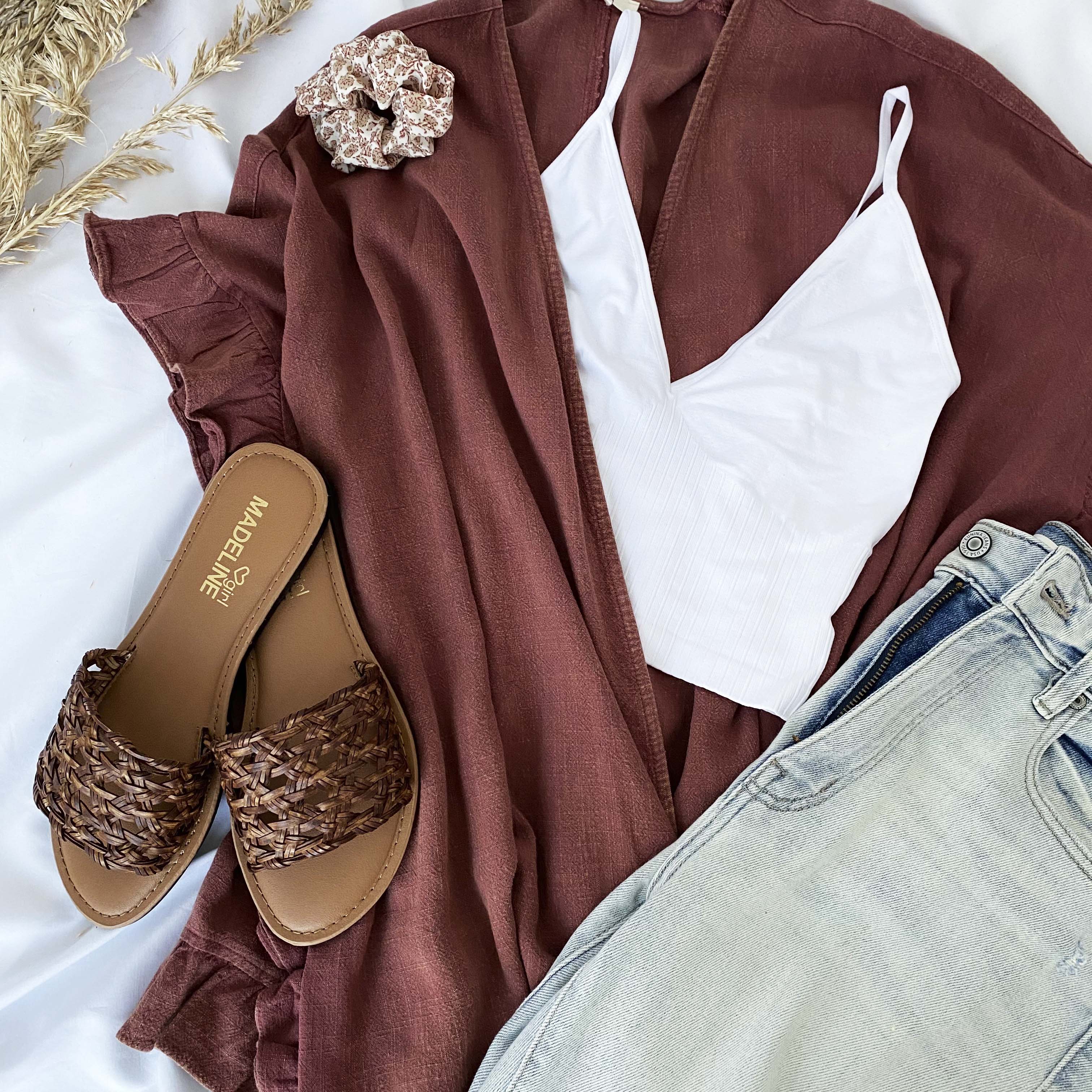 outfit containing a white tank top, madeline girl sandals and a kimono