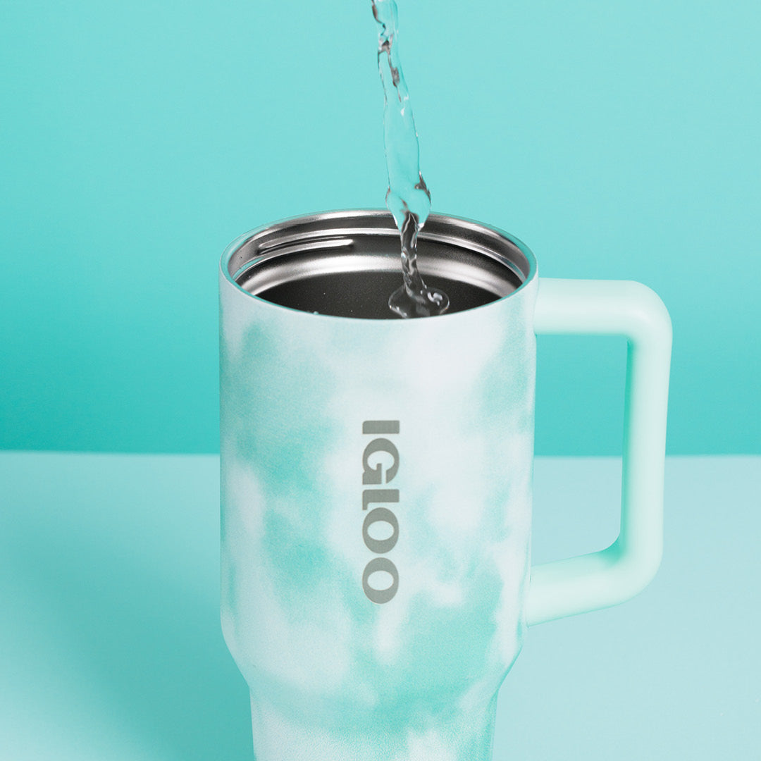 Water Being Poured Into Mug