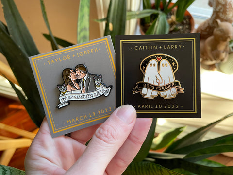 Custom wedding pins - One featuring a happy couple and their two cats, the other featuring two ghosts holding hands with the words "Boos Forever"