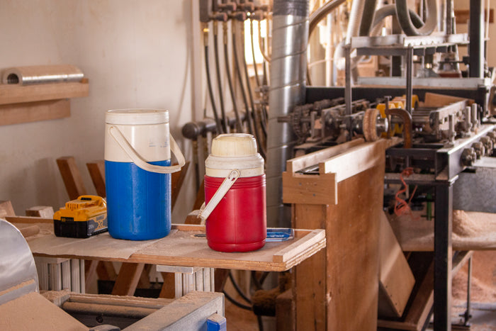 Water jugs in a woodshop