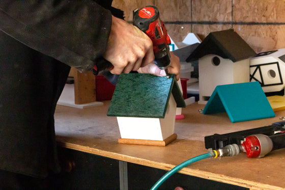 Man working on birdhouse