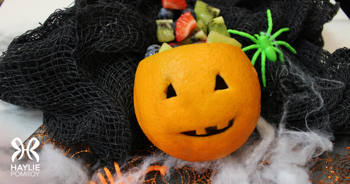 Jack O'Lantern orange with fruit inside.