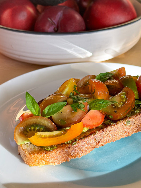 Image of toast with organic vegan cherry tomato bruschetta on top