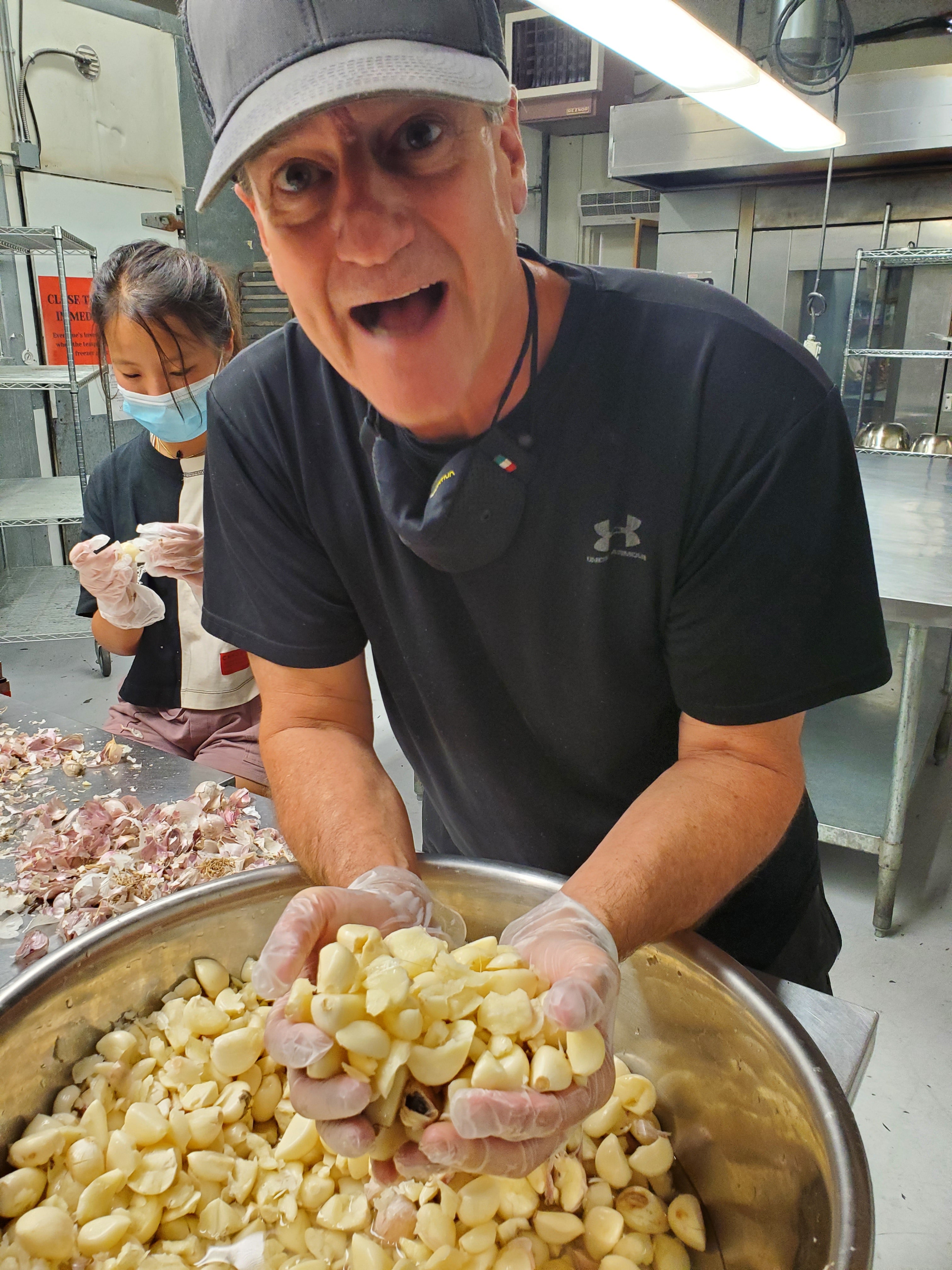 Healthy Harvest owner making garlic olive oil