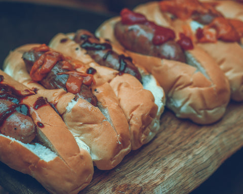 Hot Dog topped with the perfect combo: Tomato Ketchup, South Carolina BBQ Sauce and Smoky Chipotle Ketchup.