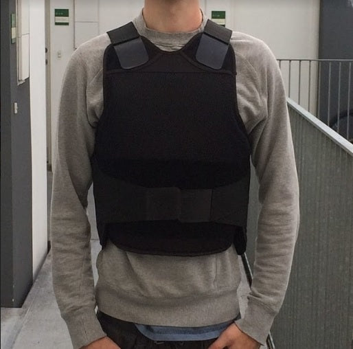 Man wearing a black bulletproof vest